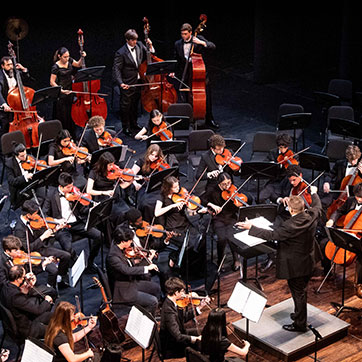 The student orchestra playing. Links to Gifts of Life Insurance