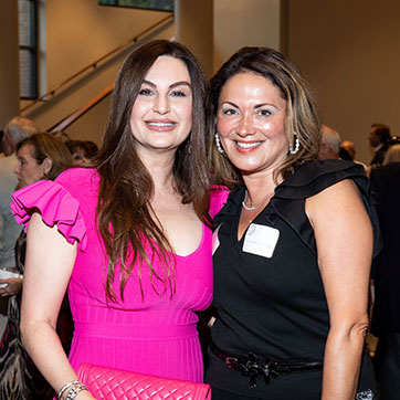 Two women smiling. Links to Closely Held Business Stock