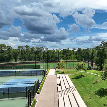 A tennis court and baseball field. Links to Gifts by Estate Note